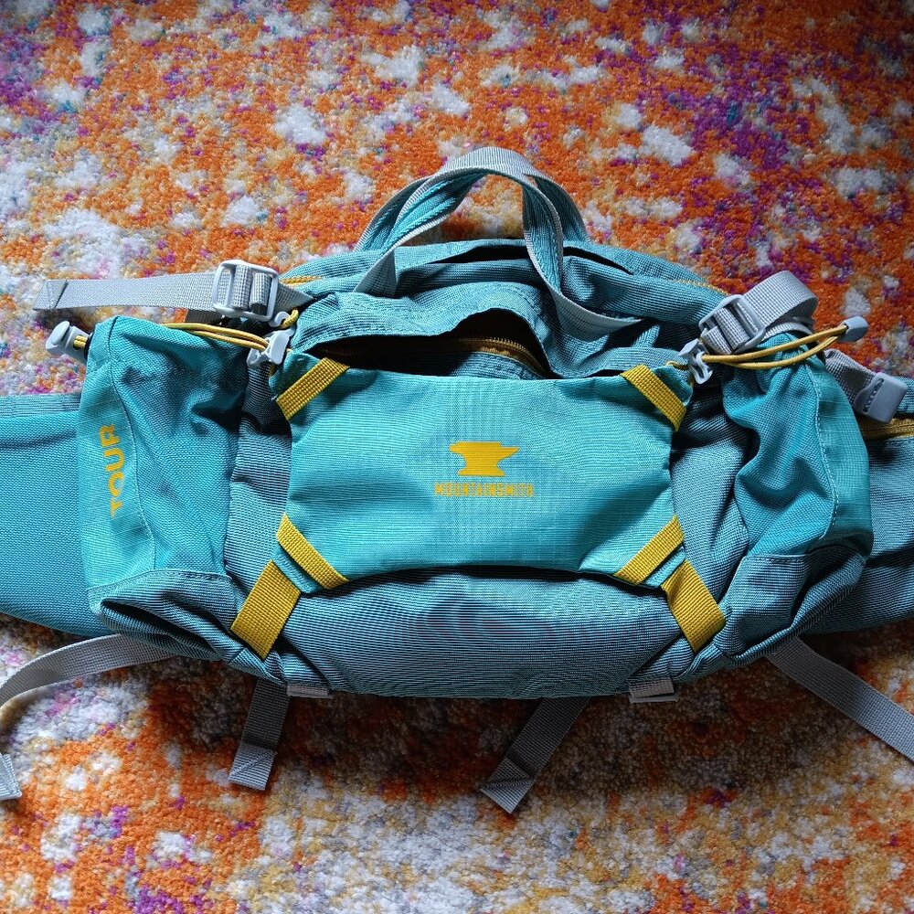 Mountainsmith Tour Lumbar Pack in a light teal
